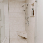 White Bathroom Shower with Large Glass Doors 2